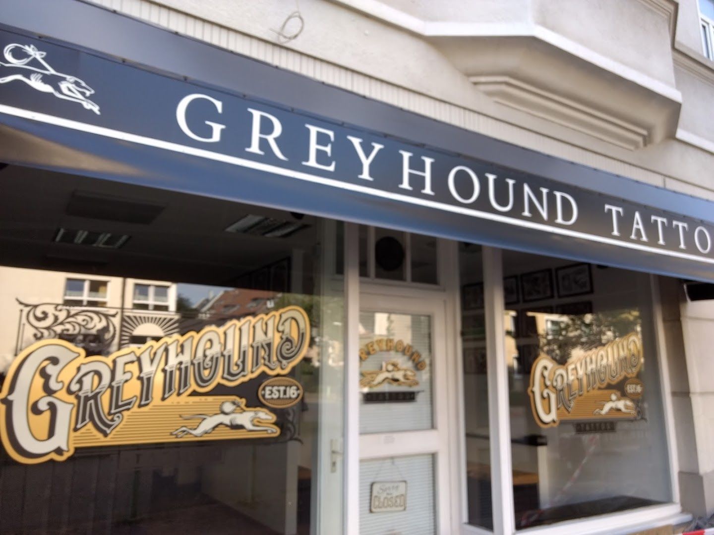 a storefront with a sign that says greyhound