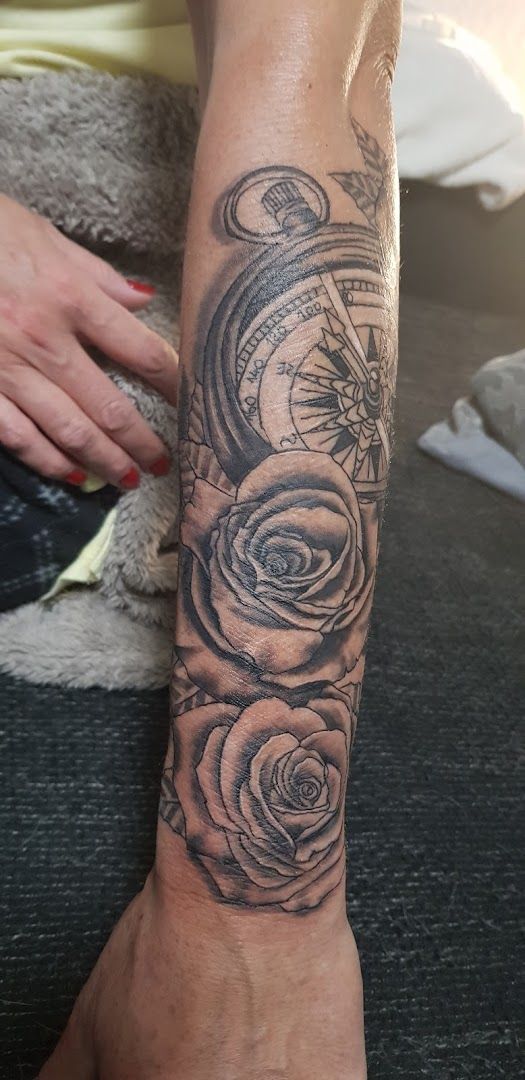 a cover-up tattoo with roses and a clock on the wrist, ennepe-ruhr-kreis, germany