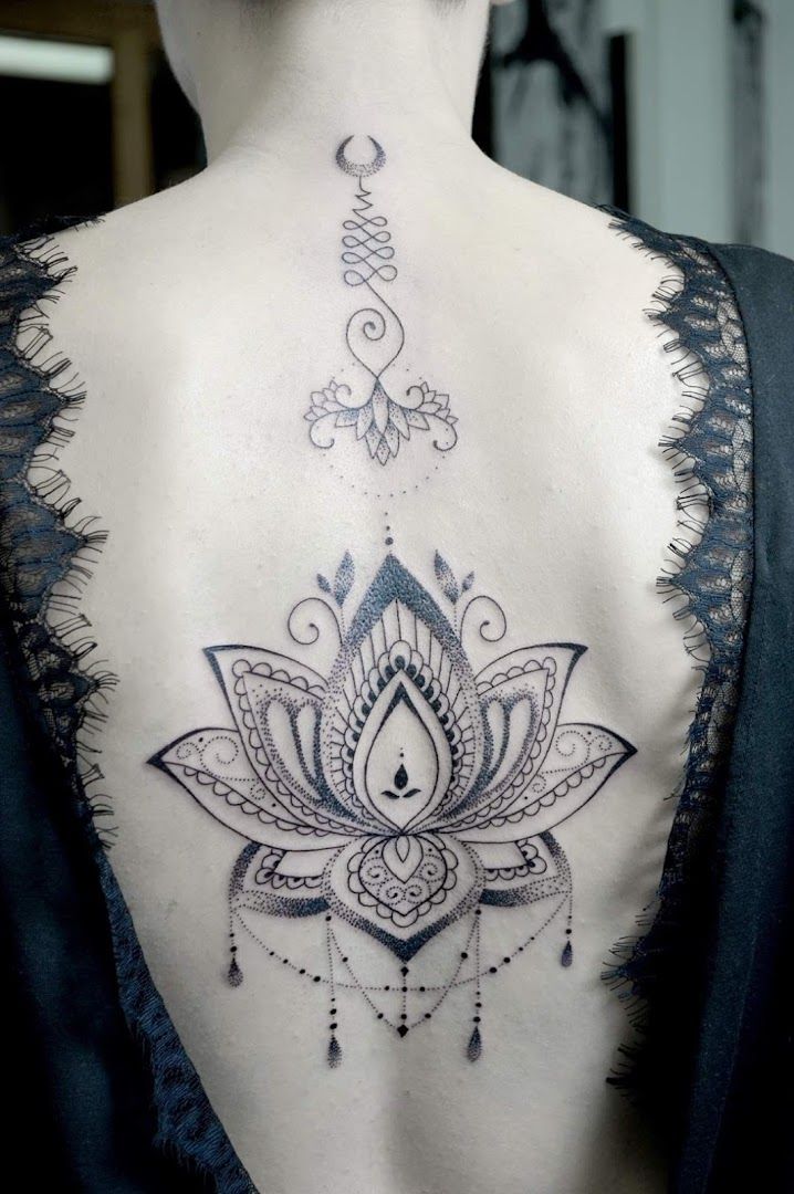 a woman with a lotus cover-up tattoo on her back, aichach-friedberg, germany