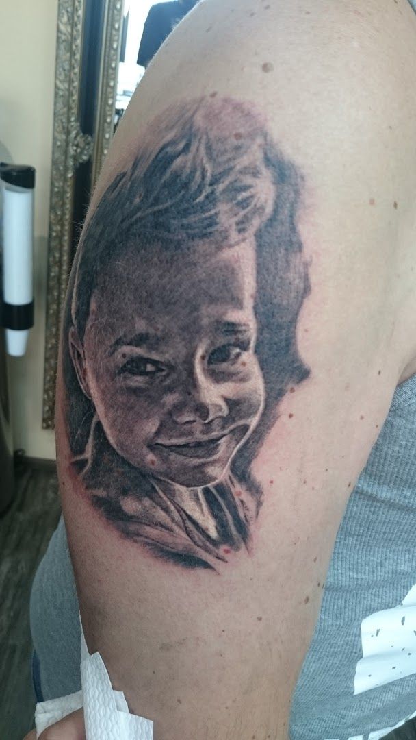 a cover-up tattoo of a man's face, nürnberg, germany