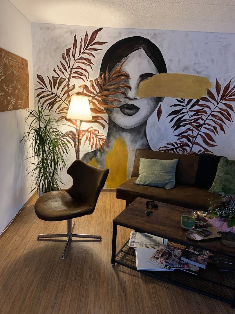 a living room with a large mural on the wall