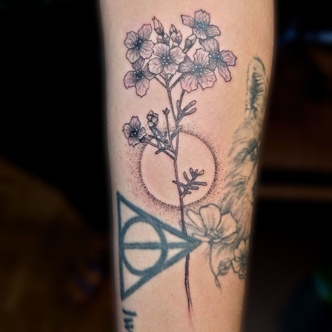 a cover-up tattoo with a flower on the arm, neuburg-schrobenhausen, germany