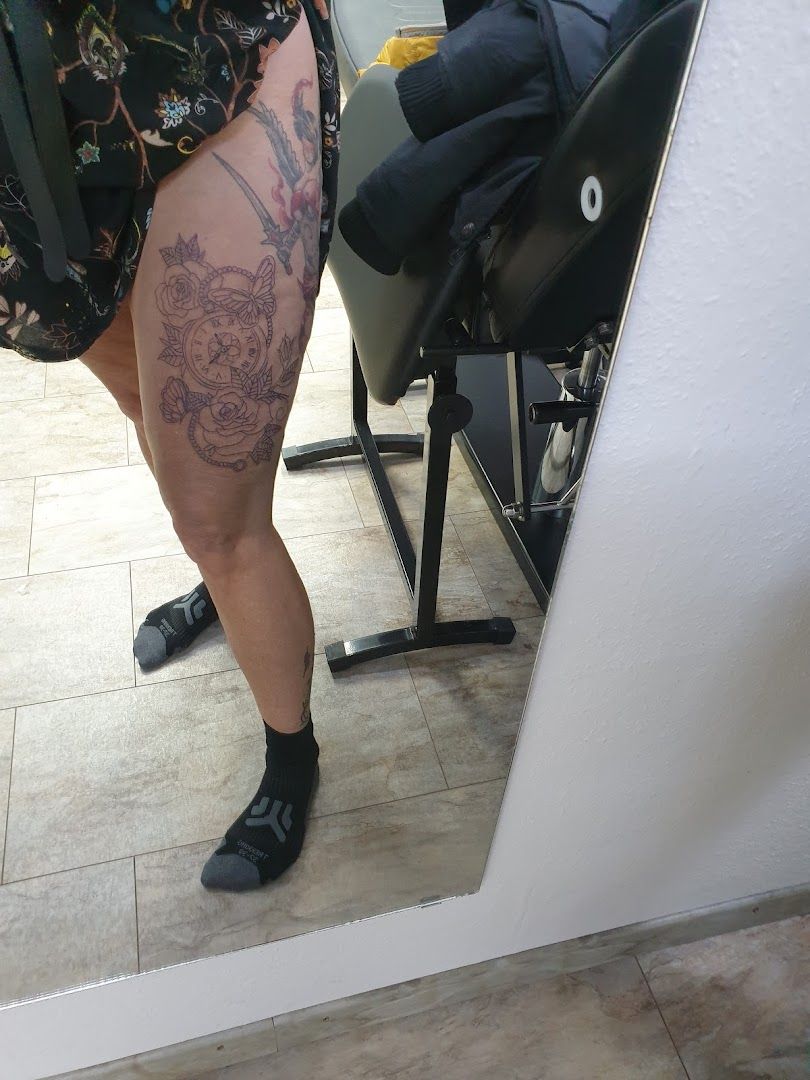 a woman with a cover-up tattoo on her thigh, reutlingen, germany