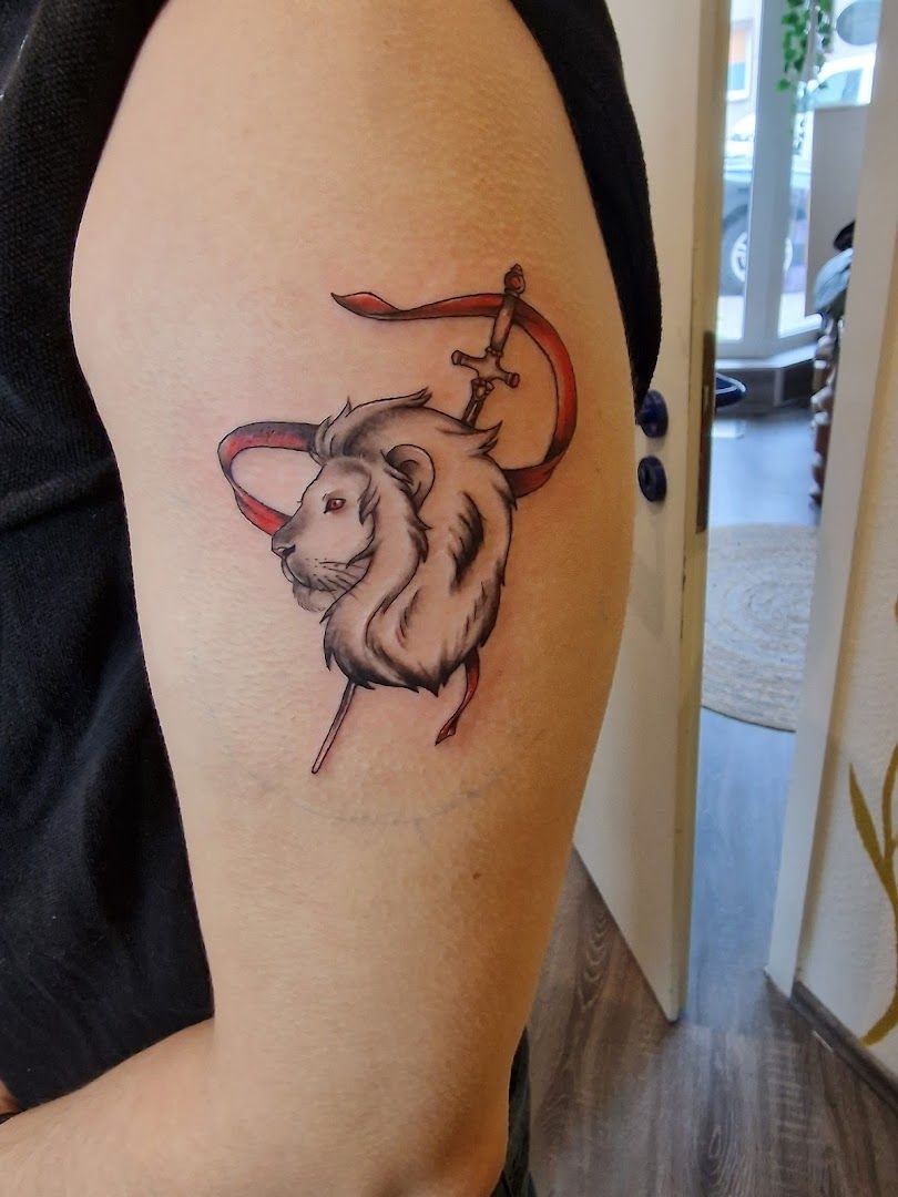 a narben tattoo of a bull with a red flag on its back, bochum, germany