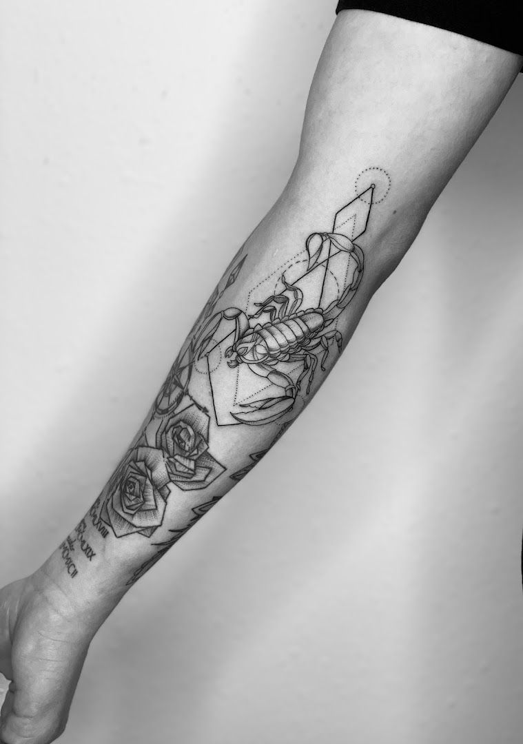 a black and white japanische tattoos in leipzig of a woman's hand with a rose, saarlouis, germany