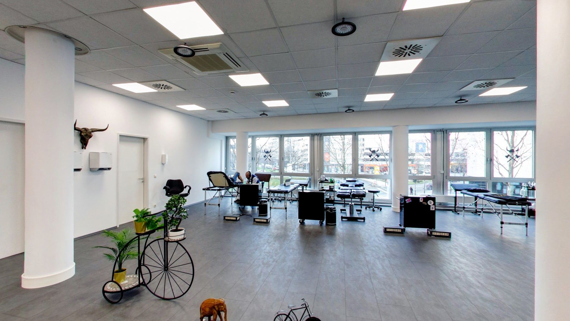 a room with a bike and a desk