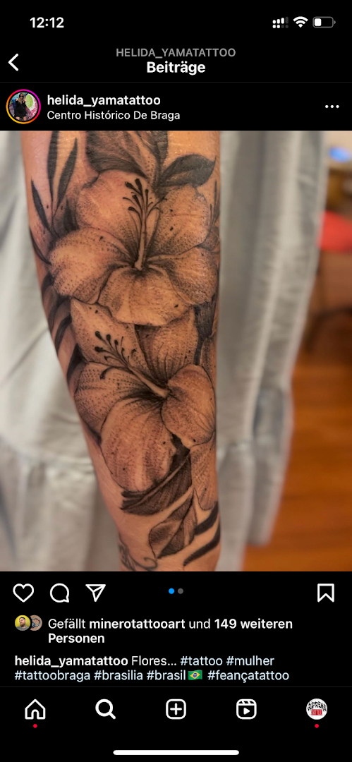 a narben tattoo with a flower on the arm, rosenheim, germany