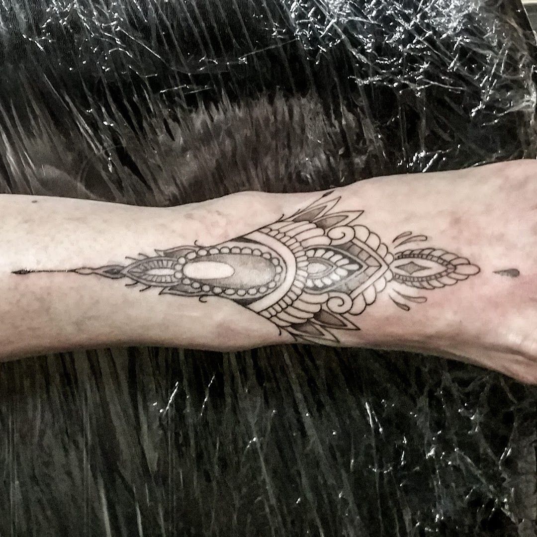 a cover-up tattoo on the arm of a man, paderborn, germany