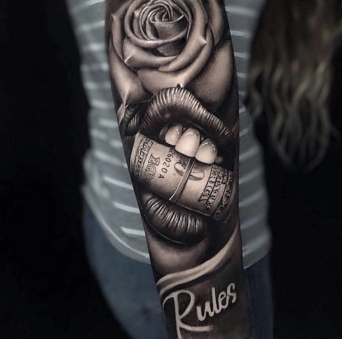 a black and white rose with a roll cover-up tattoo on the arm, kreisfreie stadt augsburg, germany