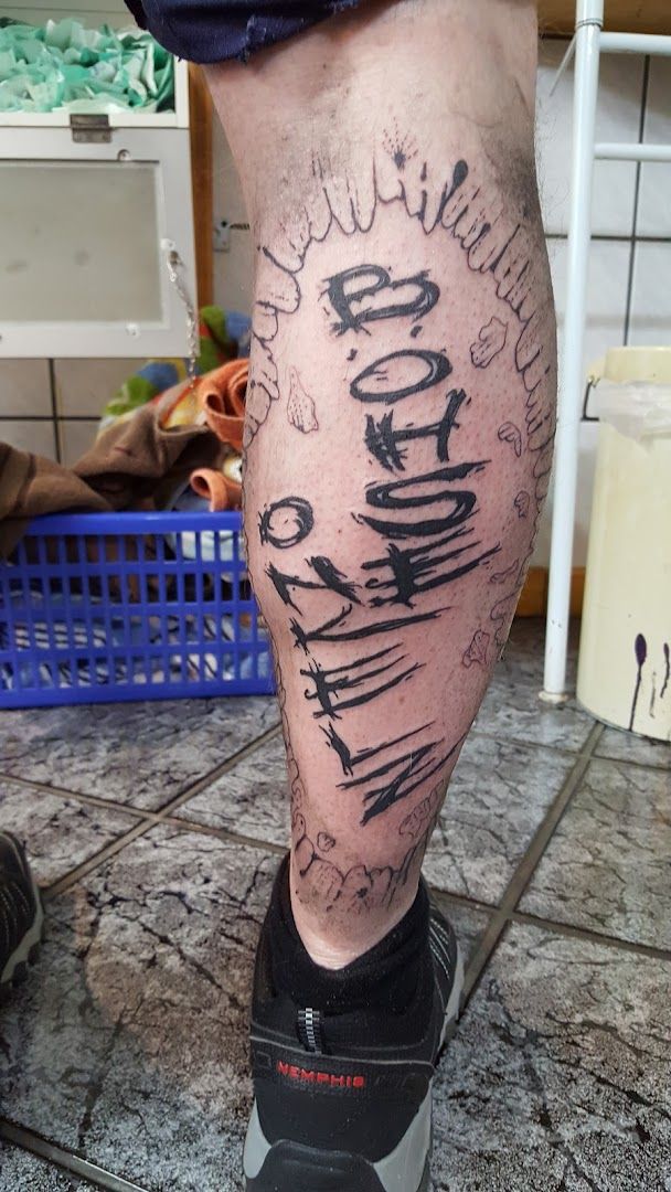 a man with a cover-up tattoo on his leg, weilheim-schongau, germany