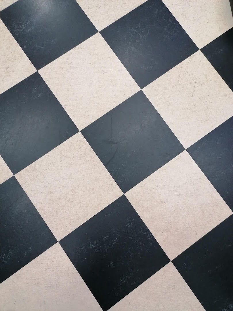 a black and white checkered floor with a black and white checkered floor