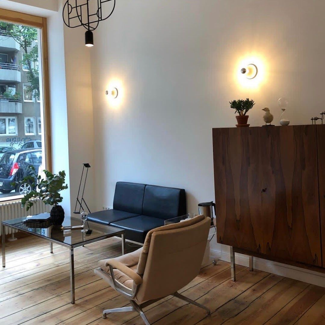 a living room with a couch and a chair