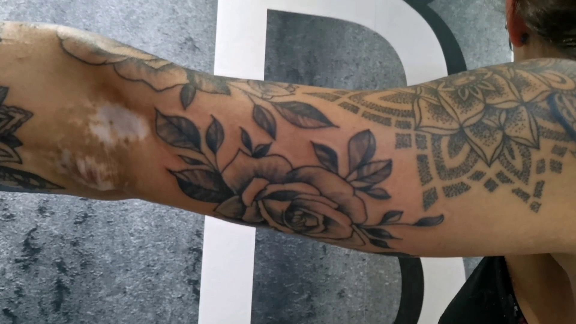 a man with a cover-up tattoo on his arm, kassel, germany