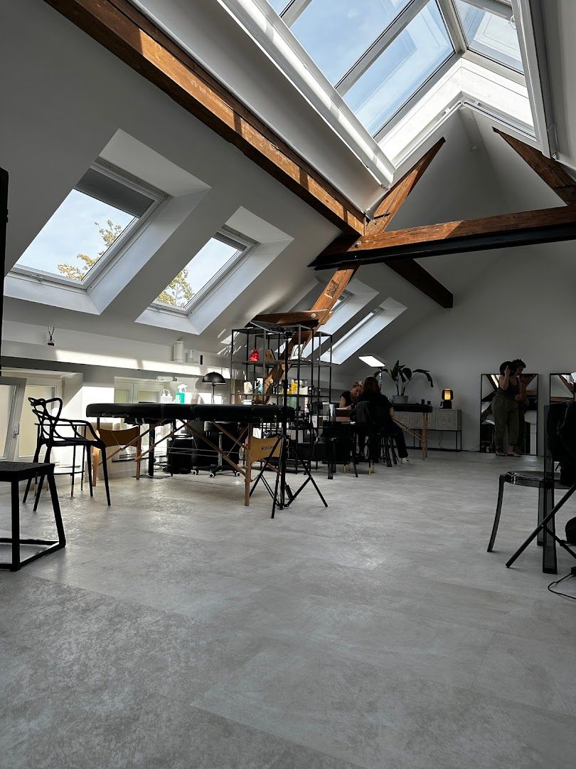 a room with a skylight and a table