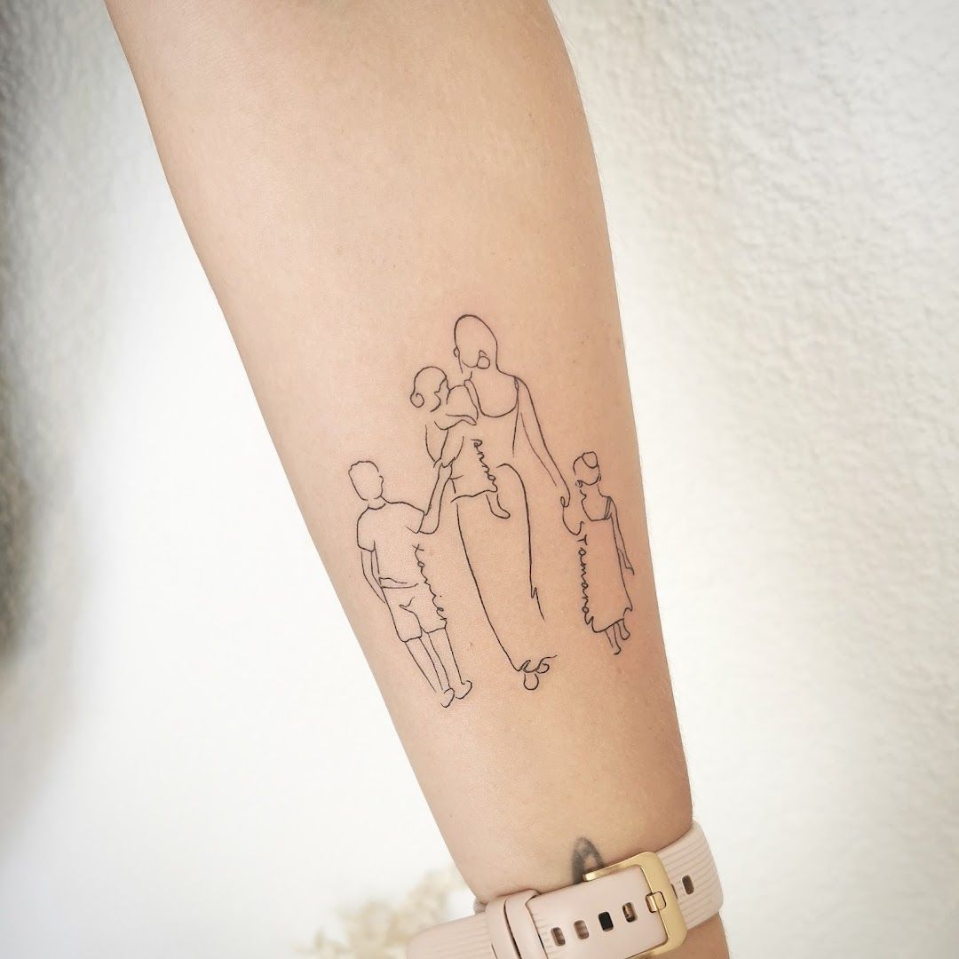 a woman's arm with a small narben tattoo of a family, breisgau-hochschwarzwald, germany