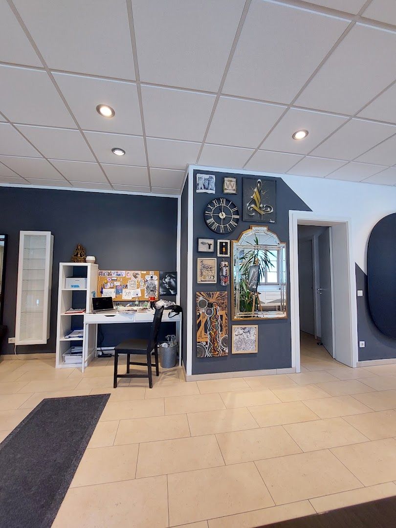 a room with a desk and a clock