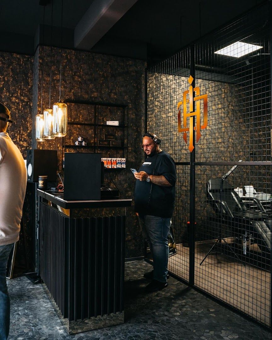 a man standing in front of a bar