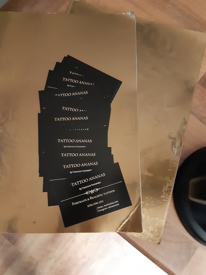a black and gold foiled menu with a black and gold foil foil foil on it
