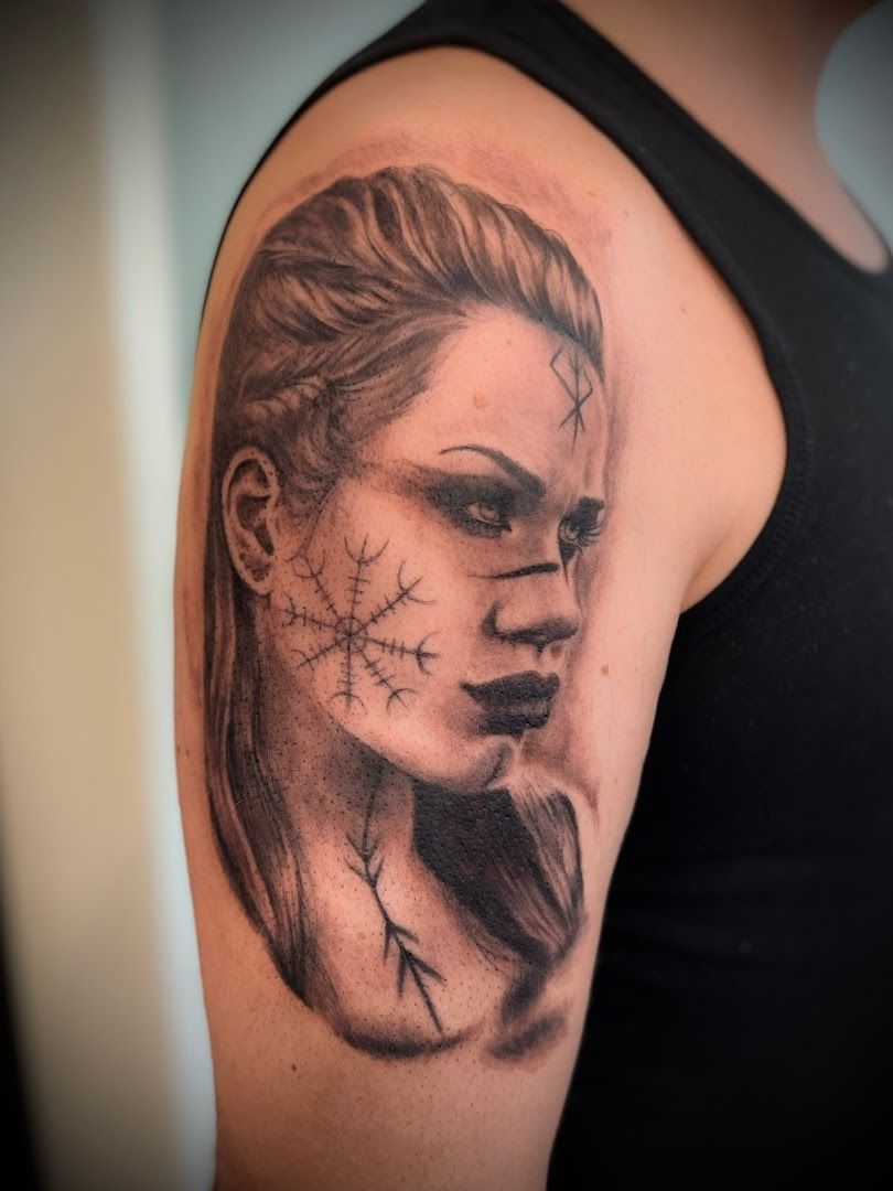 a woman's face with a skull on her shoulder