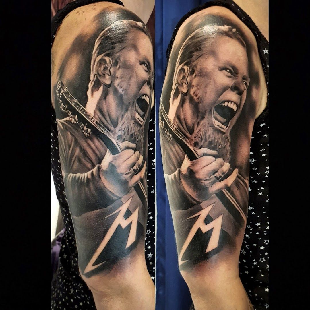a man with a guitar and lightning cover-up tattoo on his arm, mettmann, germany