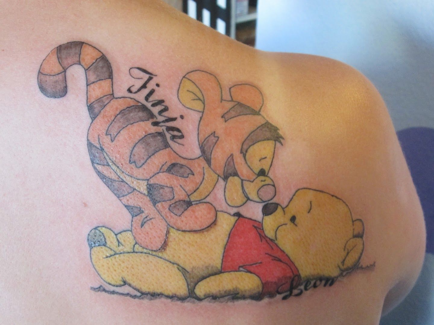 a narben tattoo of winnie and poo, berlin, germany