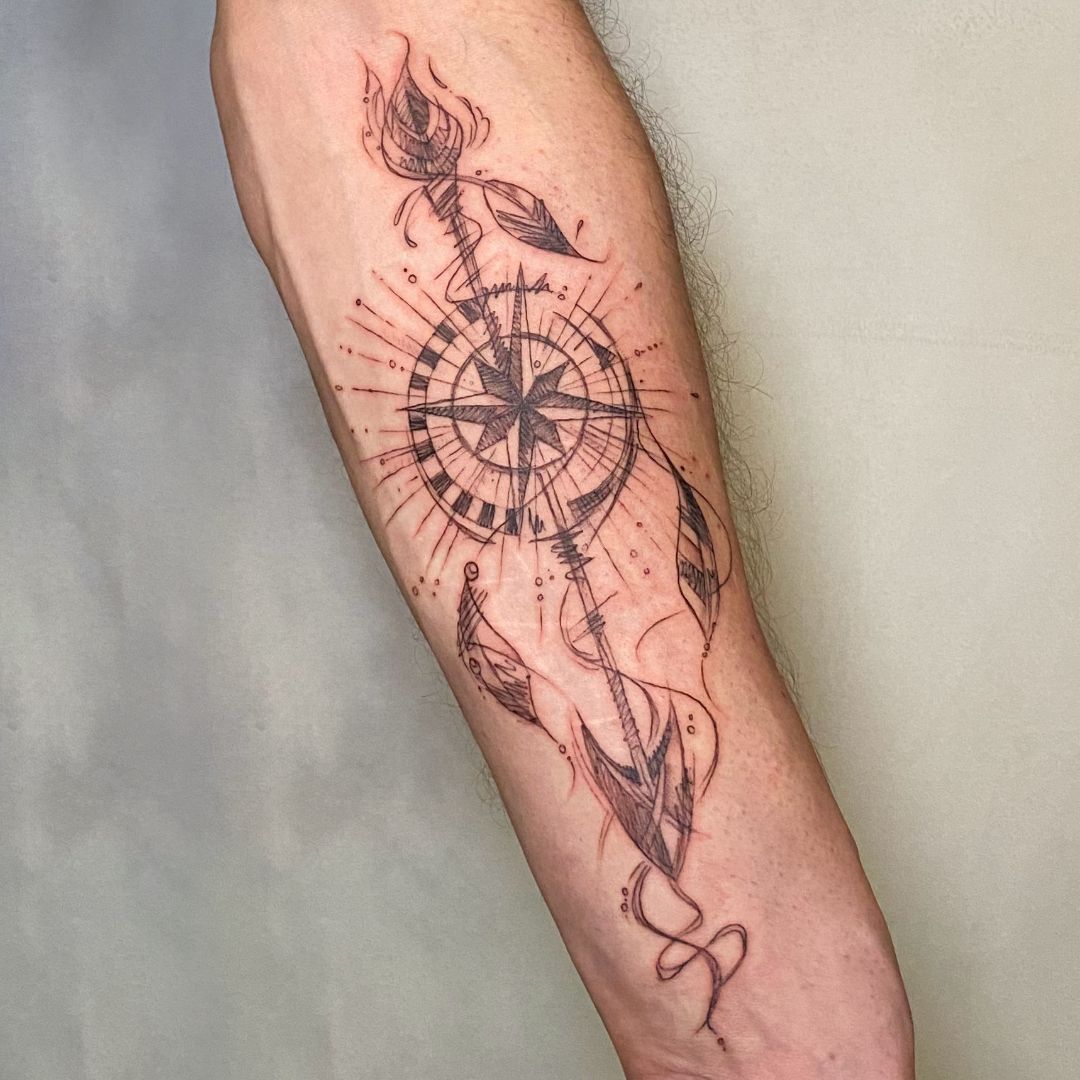 a narben tattoo with a compass and a bird, freising, germany