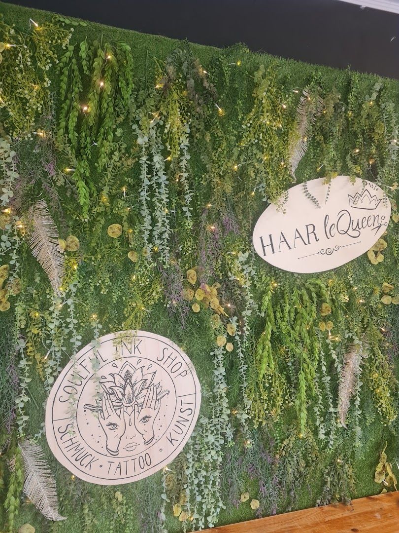 a green wall with a sign that says happy new year