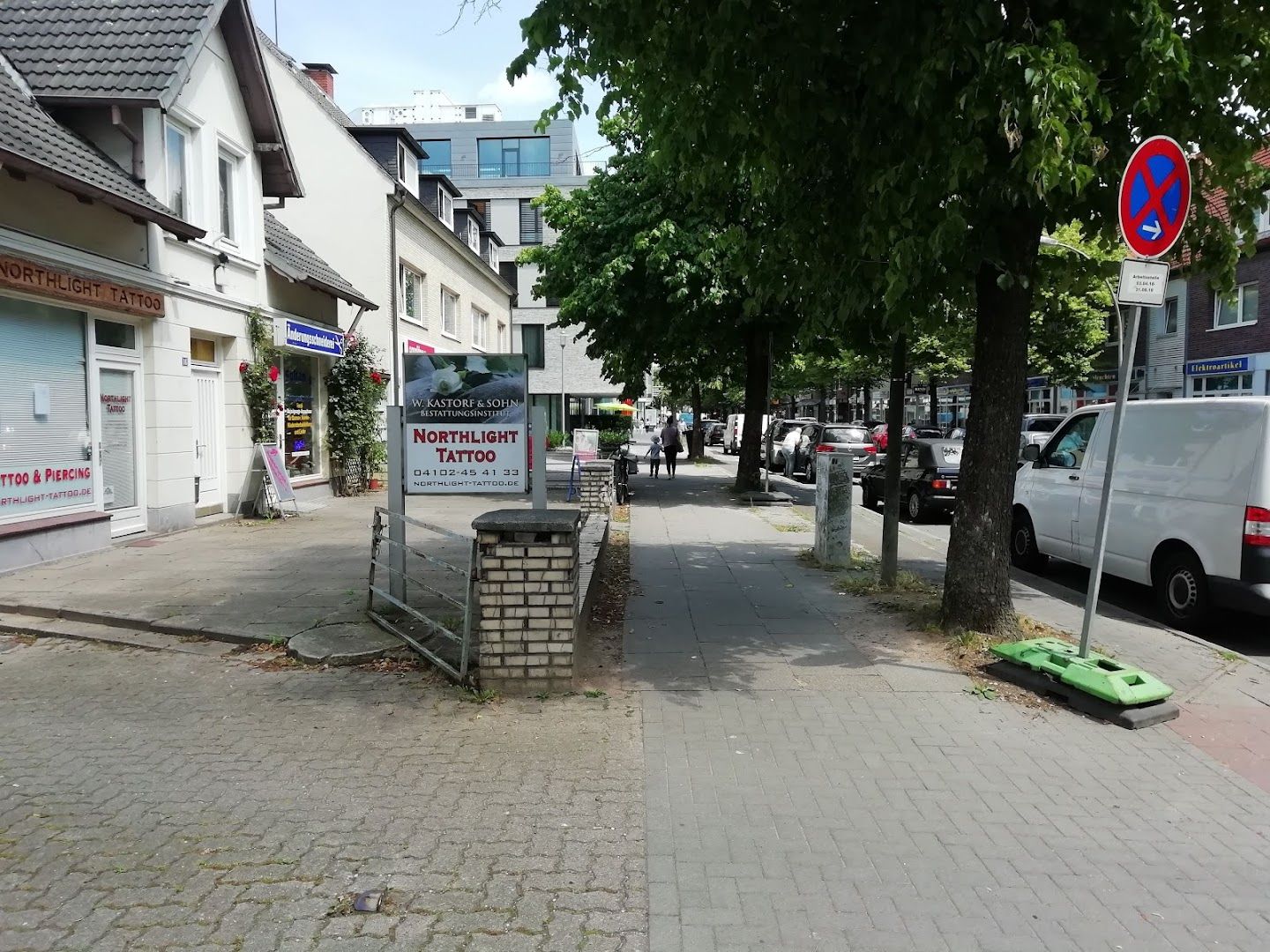 a street with cars parked on the side of it