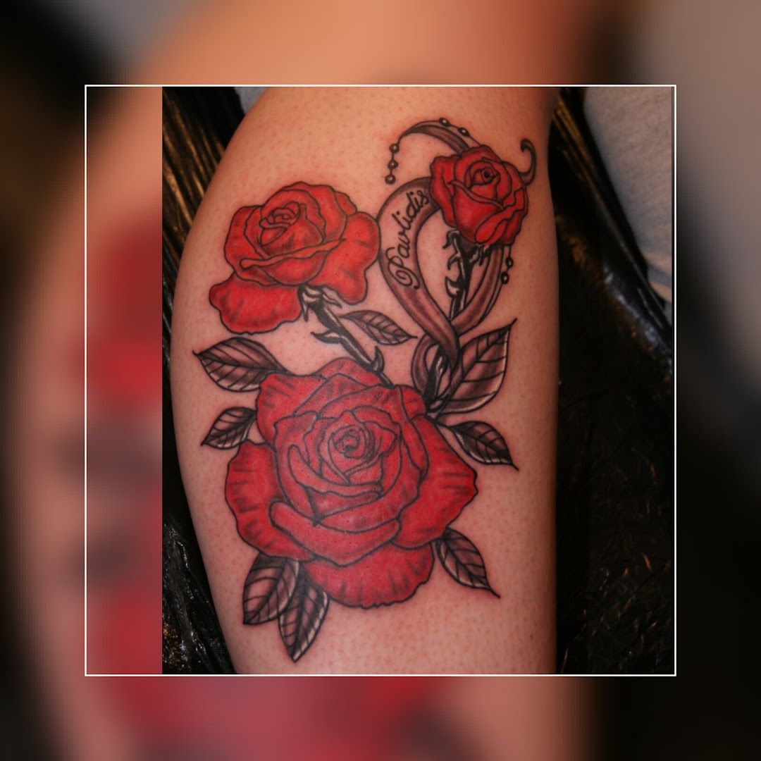 a narben tattoo with roses on the arm, ravensburg, germany