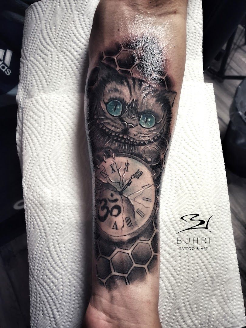 a cat with a clock narben tattoo on the arm, dahme-spreewald, germany