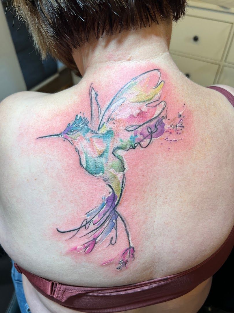 a woman with a narben tattoo on her back, northeim, germany