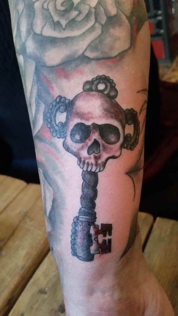 a japanische tattoos in leipzig with a skeleton and a rose on it, schaumburg, germany