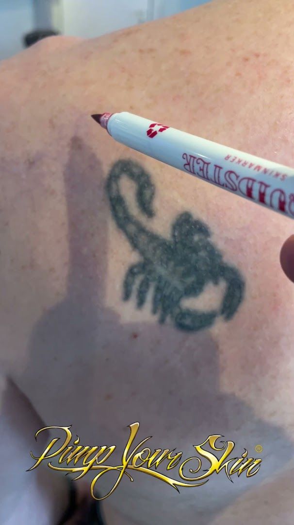 a person with a cover-up tattoo on their back, augsburg, germany