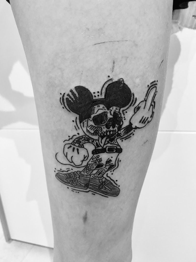 a narben tattoo of mickey mouse on the leg, ostallgäu, germany