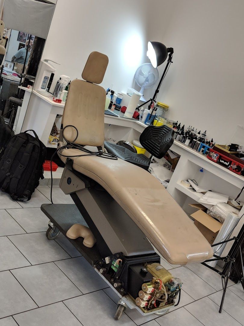 a salon chair with a hair dryer and a hair dryer