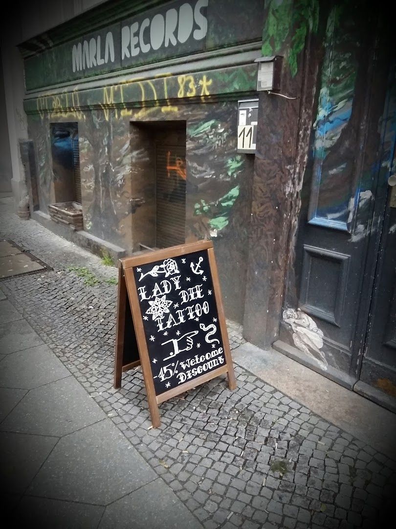 a chalk board with a chalk board on the sidewalk