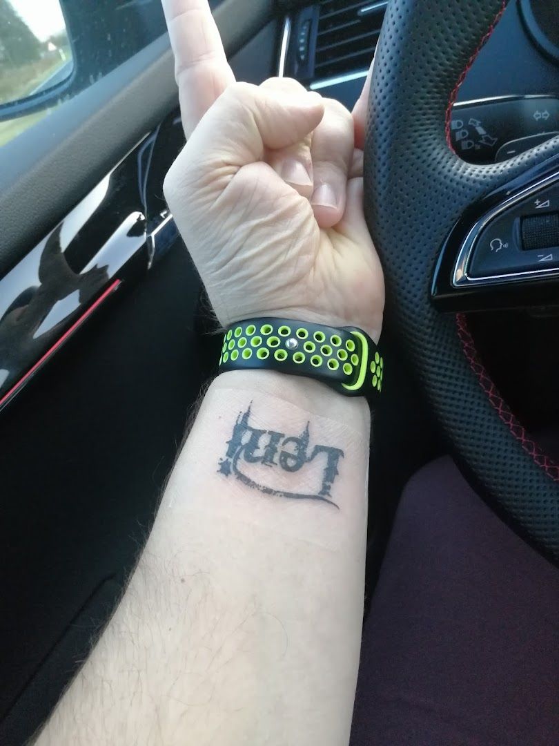 a person with a wrist cover-up tattoo on their wrist, neustadt (aisch)-bad windsheim, germany