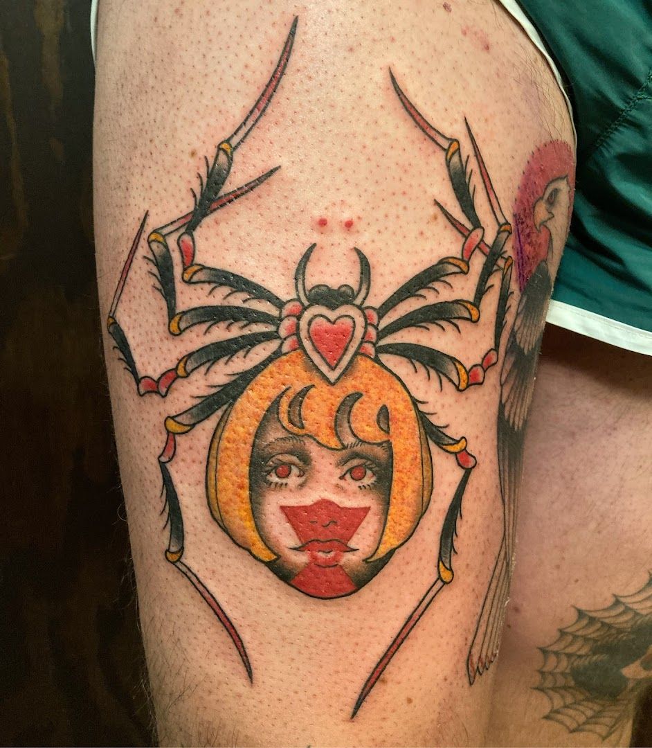 a narben tattoo of a spider with a heart on it, berlin, germany