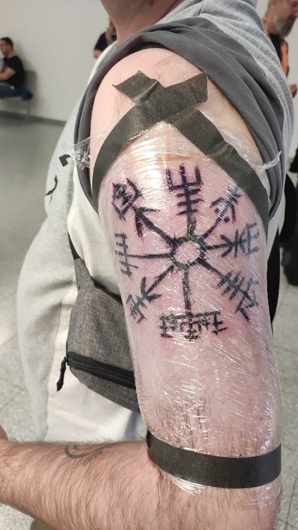 a man with a cover-up tattoo on his arm, gütersloh, germany