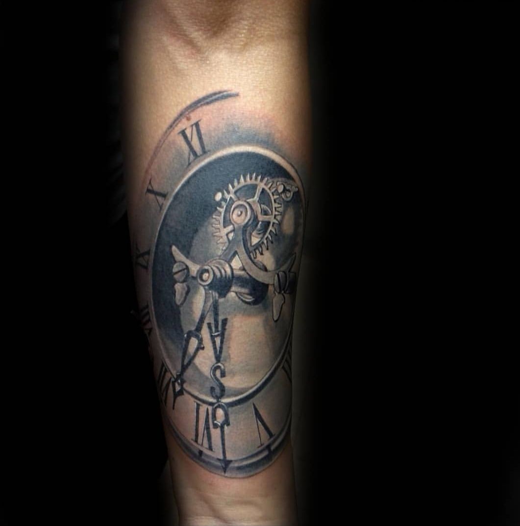 a clock narben tattoo on the arm, frankfurt, germany