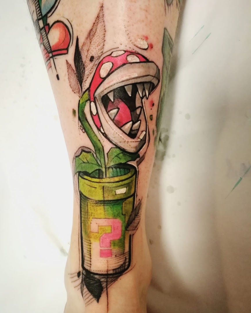 a narben tattoo of a clown with a green hat and a red nose, berlin, germany