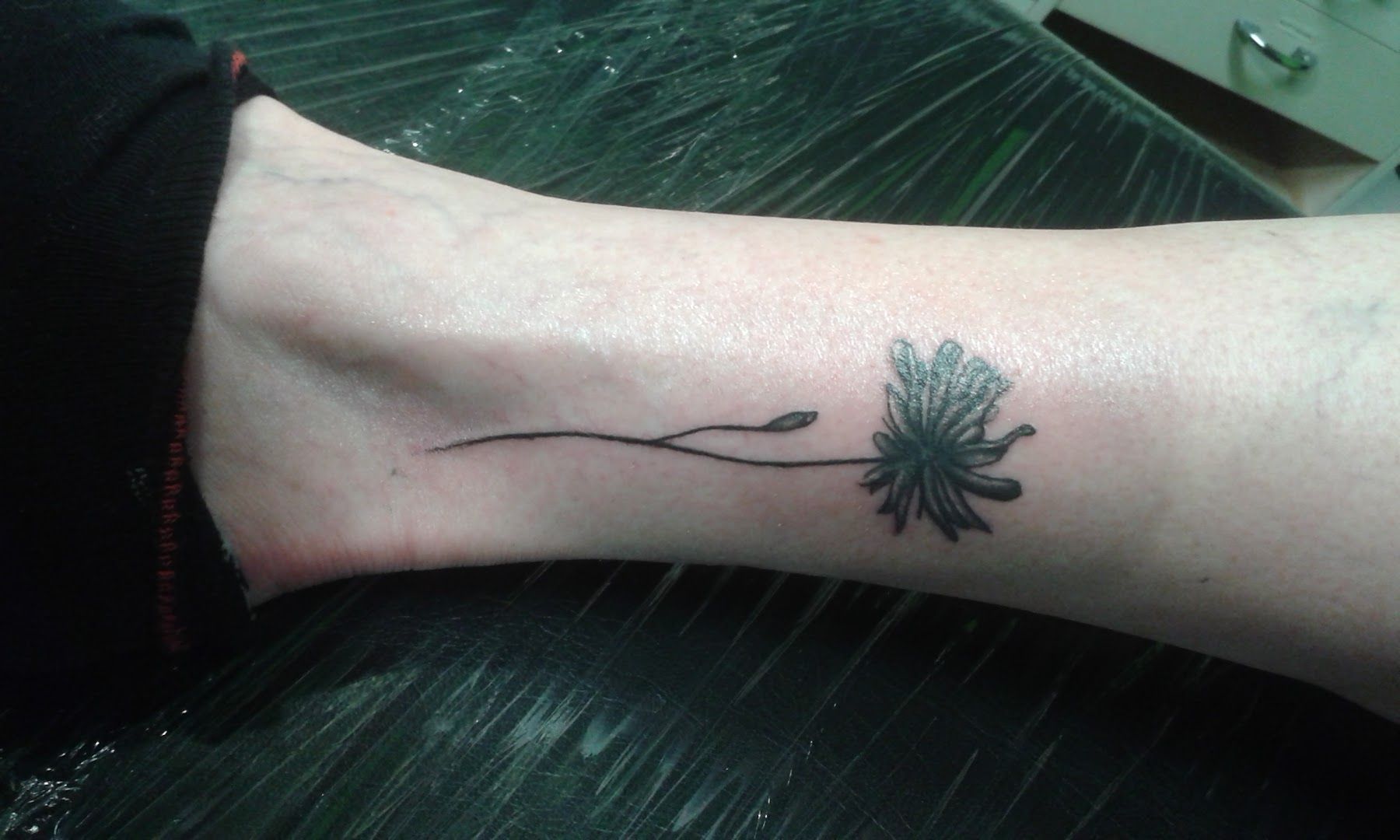 a japanische tattoos in leipzig of a flower on the wrist, main-spessart, germany