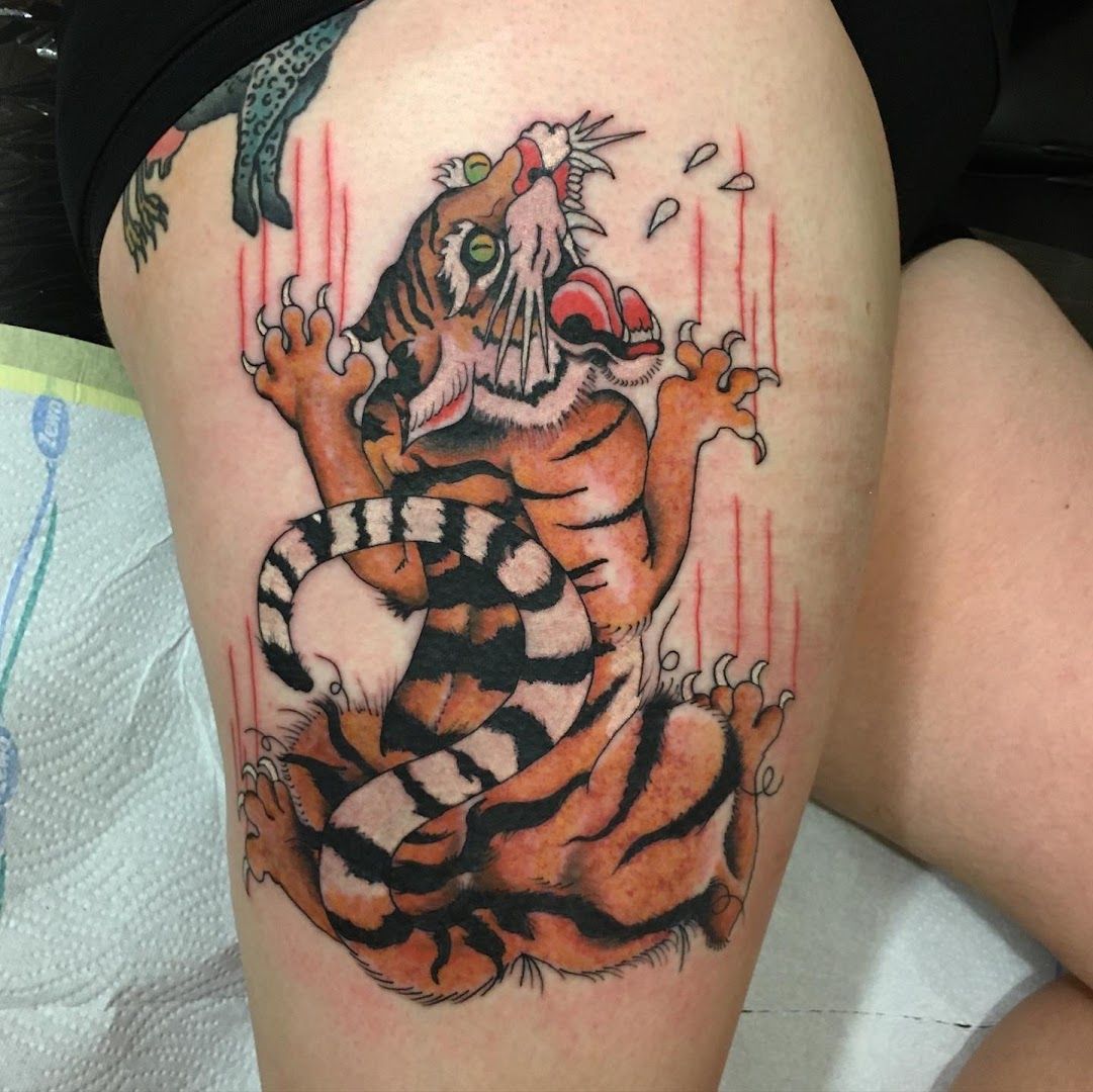 a narben tattoo of a tiger and a bird, berlin, germany