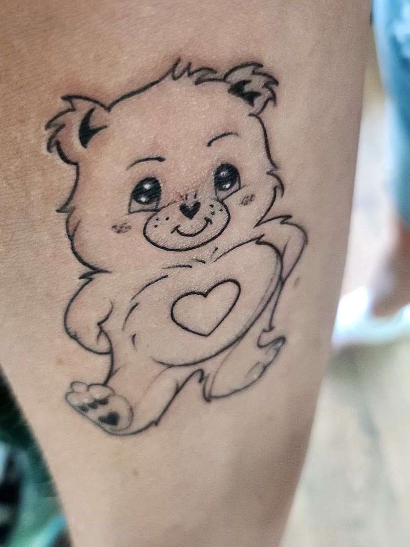 a small narben tattoo of a teddy bear, offenbach, germany