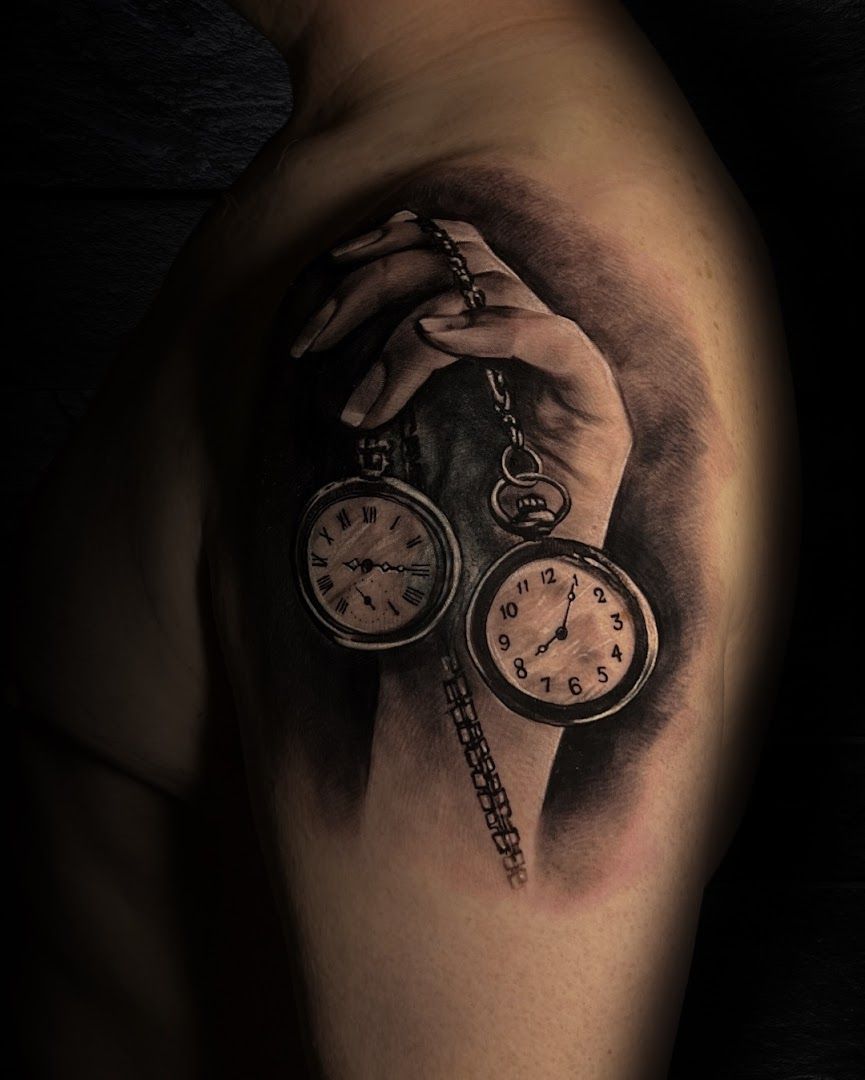 a cover-up tattoo of a hand holding a pocket watch, rhein-neckar-kreis, germany