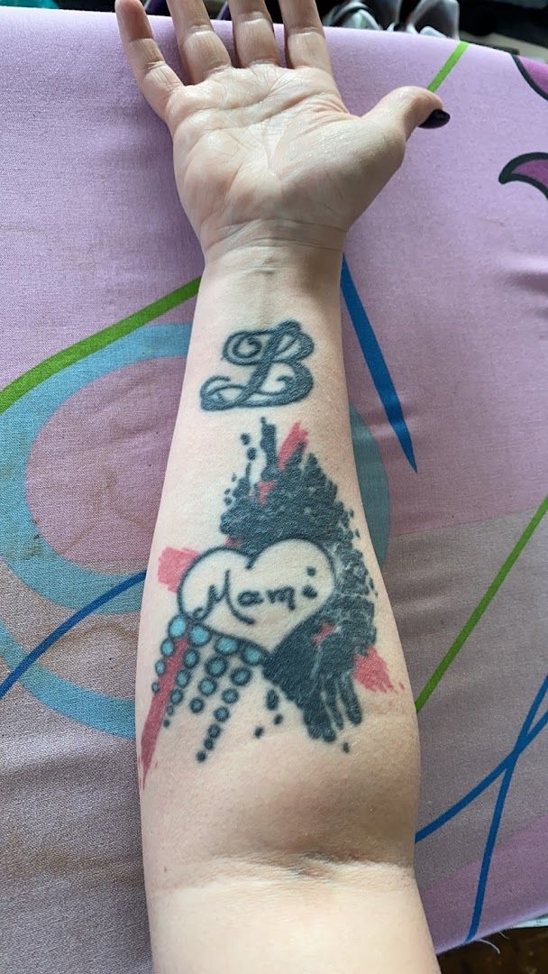 a person with a narben tattoo on their arm, düren, germany