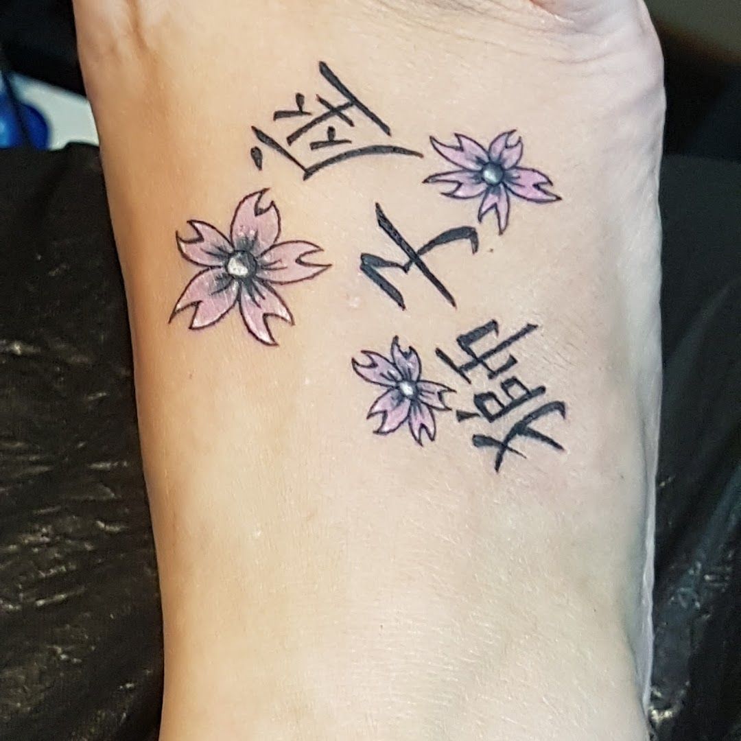 a cover-up tattoo with chinese writing on the ankle, bielefeld, germany