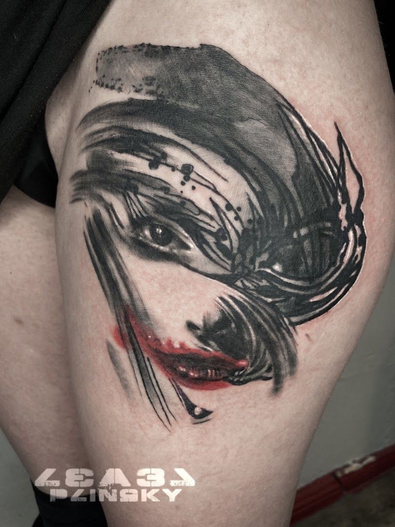 a narben tattoo of a joker with a red nose, berlin, germany