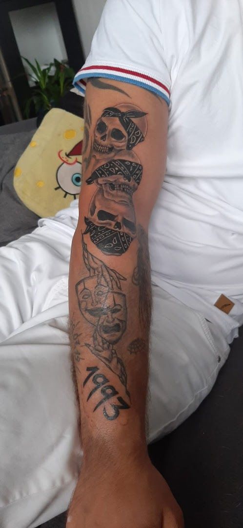 a man with a narben tattoo on his arm, berlin, germany