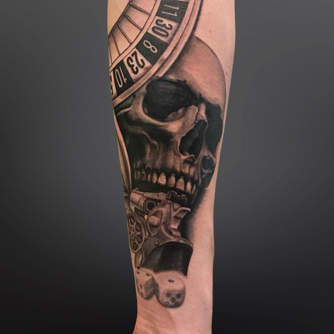 a skull with a clock on it's arm